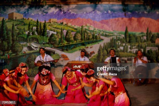 An Uighur folkloric group performs a dance show in a hotel in Turpan August, 1995 in Turpan, China.