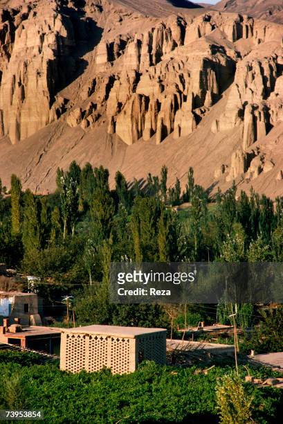 Small earth brick houses are used as drying sheds at the feet of the Flaming Mountains August, 1995 in Turpan, China.