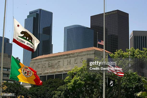 Flags fly half-staff near the Los Angeles Times building April 23, 2007 in Los Angeles, California. The Times announced today that it will offer...