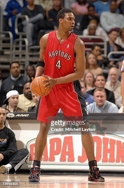 Chris Bosh of the Toronto Raptors looks to move the ball against the Washington Wizards during the game at the Verizon Center on March 30, 2007 in...