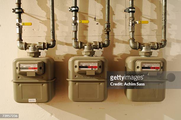 three gas meters - meter foto e immagini stock