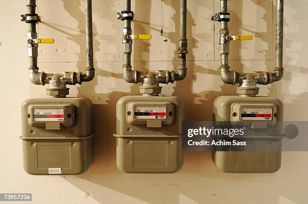 three gas meters - meter stock pictures, royalty-free photos & images