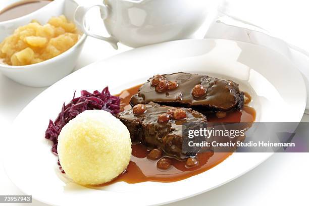 germany, rheinland, roasted beef with dumplings on plate, close-up - teigtaschen stock-fotos und bilder