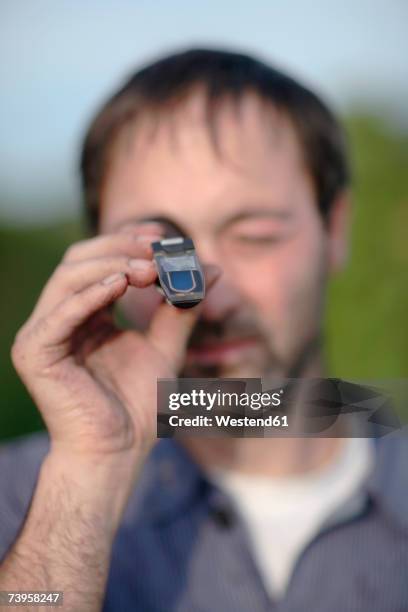 man using refractometer - refractometer stock pictures, royalty-free photos & images