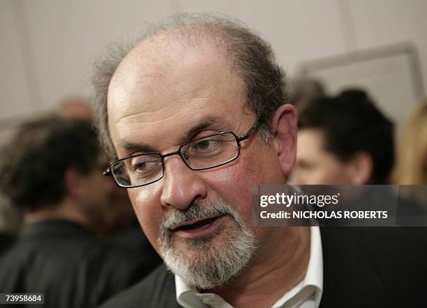New York, UNITED STATES: Author Salman Rushdie chats with attendees of the opening night of the PEN World Voices festival where author Paul Auster...
