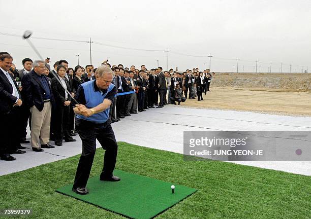 Legendary golfer Jack Nicklaus of the US hits a drive on a makeshift driving range during a ceremony to christen a golf course called the Jack...