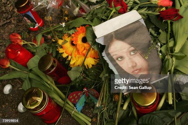 Newspaper clipping showing a picture of 14-year old Kristina Hani lies among flowers and candles at the spot in Thomashoee Park where her body was...
