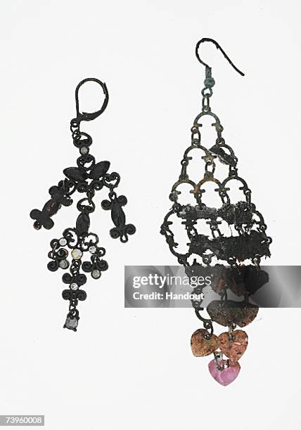 The charred earrings of 14-year old Kristina Hani are shown in this police handout photo April 24, 2007 in Berlin, Germany. According to police Hani...