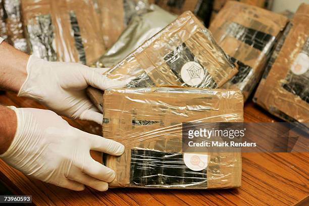 Confiscated bags containing cocaine are displayed at the Brussels Federal Police station on April 24, 2007 in the Belgian capital Brussels. 350 kg of...