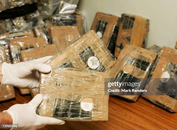 Confiscated bags containing cocaine are displayed at the Brussels Federal Police station on April 24, 2007 in the Belgian capital Brussels. 350 kg of...