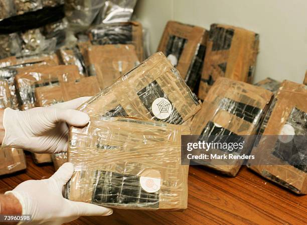 Confiscated bags containing cocaine are displayed at the Brussels Federal Police station on April 24, 2007 in the Belgian capital Brussels. 350 kg of...