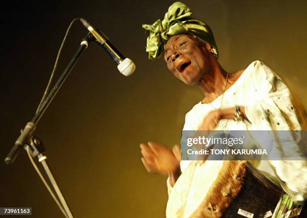 Iconic Swahili traditional music Taarab star, Zanzibar's Bi Fatuma Binti Baraka, but popularly known as Bi Kidude, performs during a show in Nairobi,...