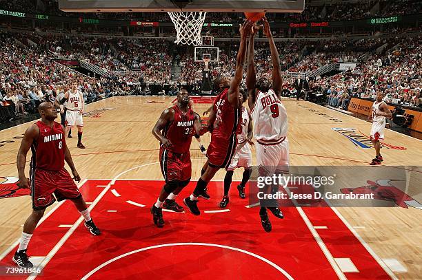 Luol Deng of the Chicago Bulls goes up for a shot attempt against Eddie Jones of the Miami Heat in Game One of the Eastern Conference Quarterfinals...