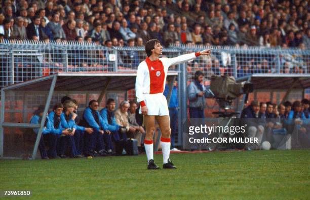 Amsterdam, NETHERLANDS: A picture taken 04 April 1982 shows Dutch football star Johan Cruijff giving directions during the match Ajax vs NEC in...