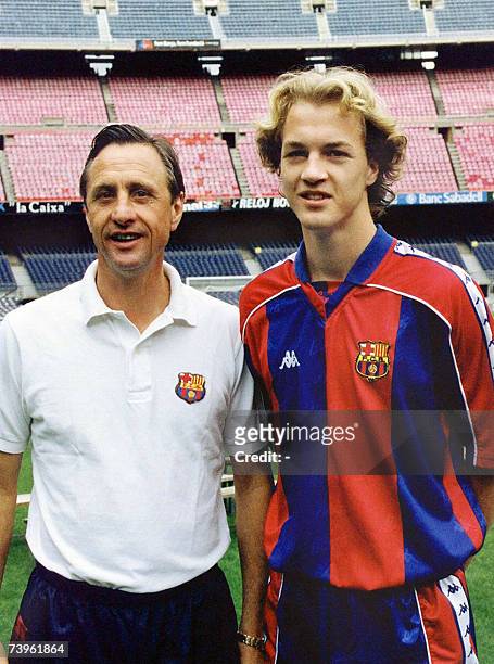 Picture taken 03 June 1995 shows Dutch football star Johan Cruyff posing with his son Jordi in Barcelona. Johan Cruyff will turn sixty on 25 April...