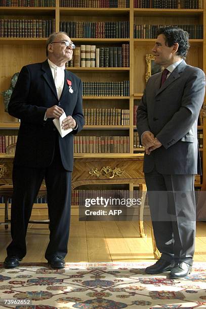 Swiss actor Bruno Ganz poses with after receiving the insigna of Chevalier of Legion of Honor by French ambassador Claude Martin , 24 April 2007 at...