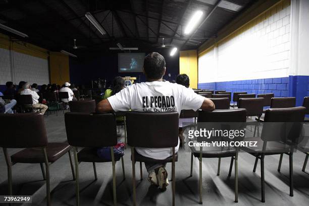 Follower of the sect "Growing in Grace" listens a on line speech of his leader Jose Luis de Jesus Miranda during a ceremony called "Calqueo" in San...