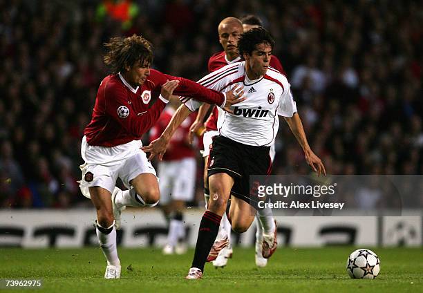 Kaka of AC Milan battles for the ball with Gabriel Heinze of Manchester United during the UEFA Champions League Semi Final, first leg match between...