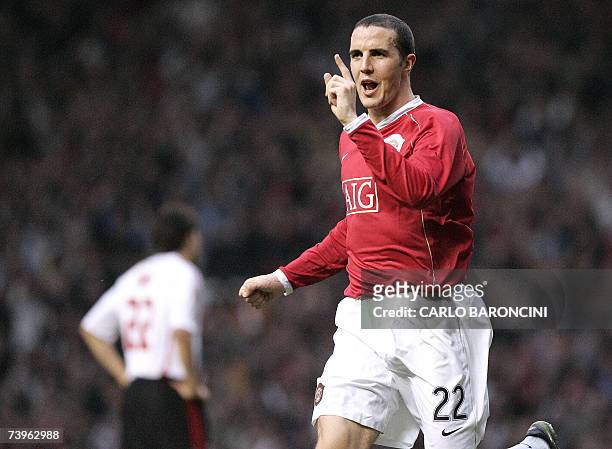 Manchester, UNITED KINGDOM: Manchester United's Irish defender John O'Shea celebrates after AC Milan's Brazilian goalkeeper Dida conceeded an own...