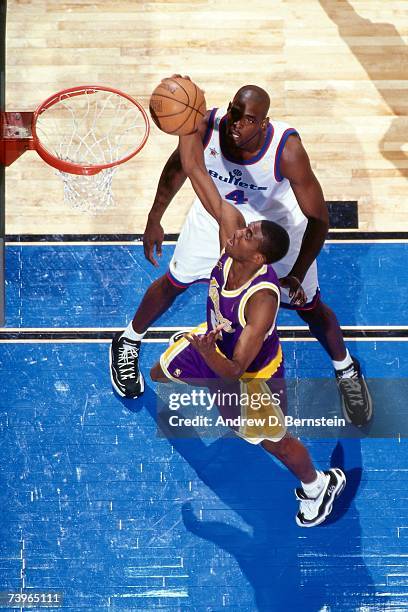 Eddie Jones of the Western Conference shoots against Chris Webber of the Eastern Conference during the 1997 All-Star Game on February 9, 1997 at Gund...