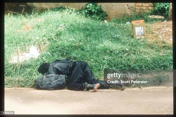 Body lies in the street April 13, 1994 in Kigali, Rwanda. Following the apparent assassination of Rwandan President Juvenal Habyarimana, a massive...