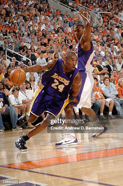 Kobe Bryant of the Los Angeles Lakers drives around Raja Bell of the Phoenix Suns in Game Two of the Western Conference Quarterfinals during the 2007...