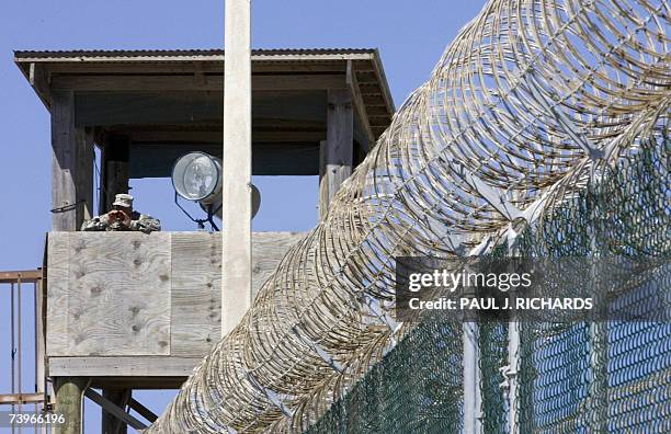 Guard yells down from a guard tower at Camp at Camp Delta in Guantanamo Bay Naval Station, Cuba, 24 April 2007. The only Canadian detained at the US...