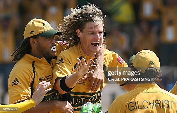 Gros Islet, SAINT LUCIA: Australian cricketer Andrew Symonds and Adam Gilchrist congratulate Nathan Bracken for the dismissal of South African...