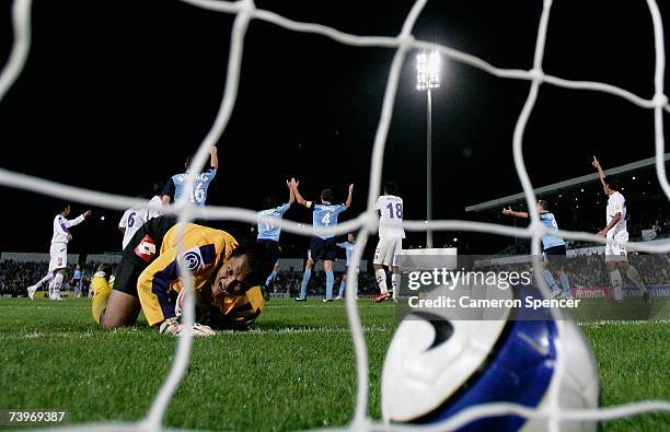 Persik Kediri goalkeeper Kurnia Sandy watches the ball after a Sydney FC goal that was disallowed during the Asian Champions League Group E match...