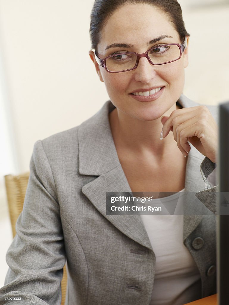 Woman sitting at her personal computer