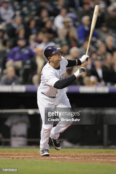 Matt Holliday of the Colorado Rockies makes a hit during the game against the San Francisco Giants on April 16, 2007 at Coors Field in Denver,...