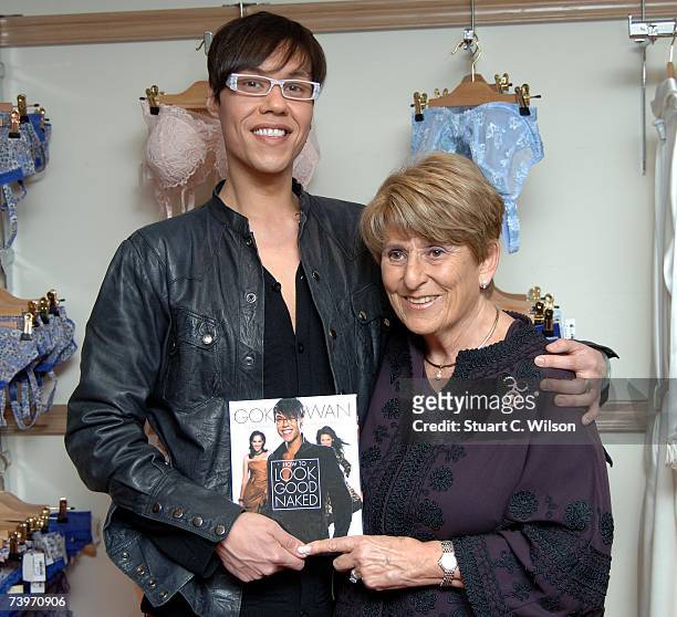 Presenter Gok Wan poses with Rigby and Peller owner June Kenton before signing copies of his new book from the TV series 'How to Look Good Naked' at...