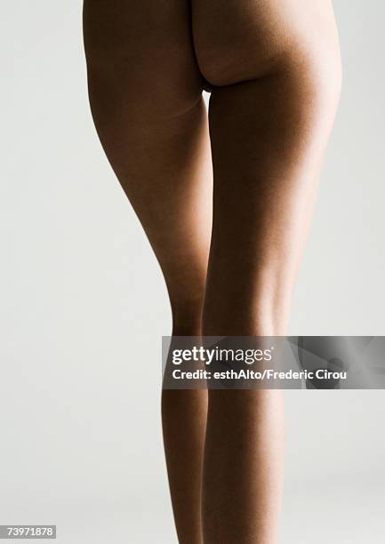 woman's bare buttocks and legs, rear view - beautiful bare women fotografías e imágenes de stock