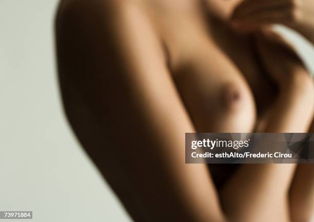 woman's bare chest, hands covering breast, close-up, defocused - beautiful bare women fotografías e imágenes de stock