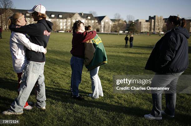 Virginia Tech students comfort each other on the drill field to honor those killed in yesterday's shootings April 17, 2007 in Blacksburg, Virginia....