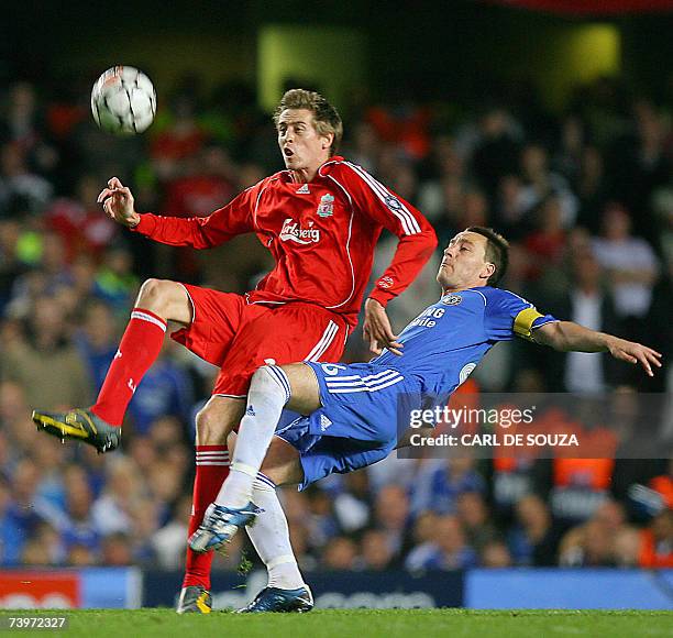 London, UNITED KINGDOM: Liverpool's English forward Peter Crouch vies with Chelsea's English defender and captain John Terry during their Champions...