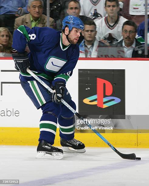 Willie Mitchell of the Vancouver Canucks skates with the puck against the Dallas Stars during Game 7 of the 2007 Western Conference Quarterfinals at...