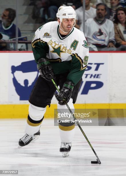 Mike Modano of the Dallas Stars skates with the puck against the Vancouver Canucks during Game 7 of the 2007 Western Conference Quarterfinals at...