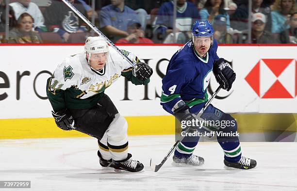 Brent Sopel of the Vancouver Canucks skates against Jeff Halpern of the Dallas Stars during Game 7 of the 2007 Western Conference Quarterfinals at...