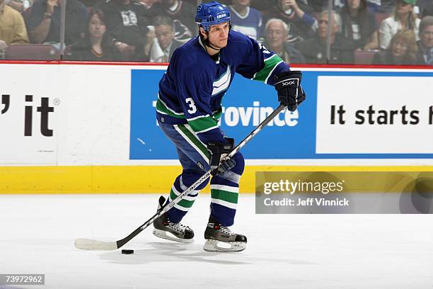 Kevin Bieksa of the Vancouver Canucks skates with the puck against the Dallas Stars during Game 7 of the 2007 Western Conference Quarterfinals at...