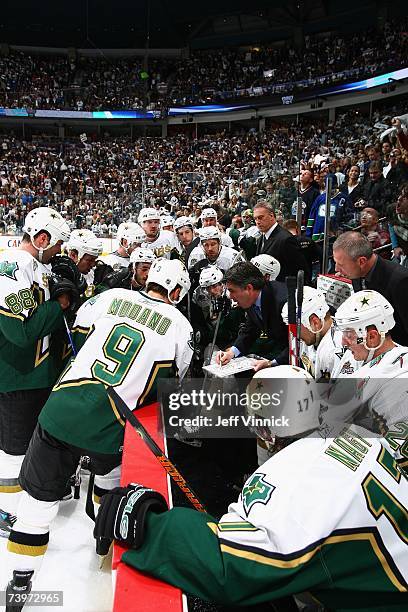 Head coach Dave Tippett of the Dallas Stars diagrams a play from the bench against the Vancouver Canucks during Game 7 of the 2007 Western Conference...