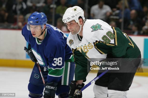 Jan Bulis of the Vancouver Canucks lines up against Eric Lindros of the Dallas Stars during Game 7 of the 2007 Western Conference Quarterfinals at...