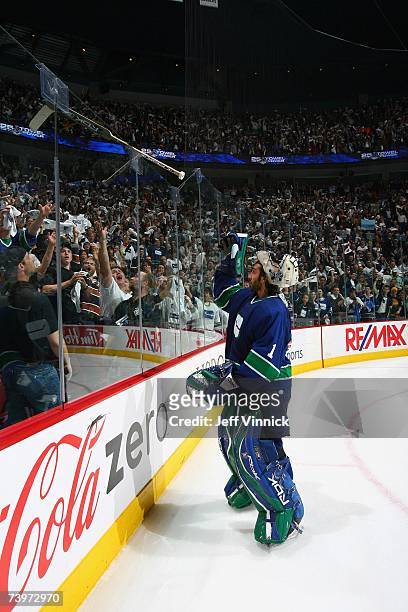 Roberto Luongo of the Vancouver Canucks tosses his stick into the stands following the game against the Dallas Stars during Game 7 of the 2007...