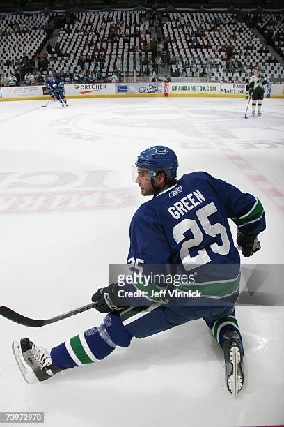 Josh Green of the Vancouver Canucks stretches during warmups before the game against the Dallas Stars in Game 7 of the 2007 Western Conference...