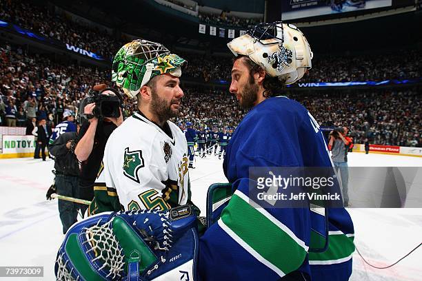 Roberto Luongo of the Vancouver Canucks shakes hands with Marty Turco of the Dallas Stars following Game 7 of the 2007 Western Conference...