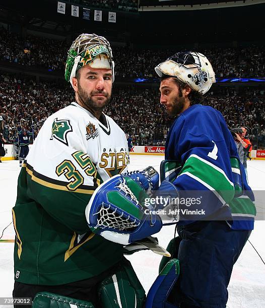 Roberto Luongo of the Vancouver Canucks shakes hands with Marty Turco of the Dallas Stars following Game 7 of the 2007 Western Conference...