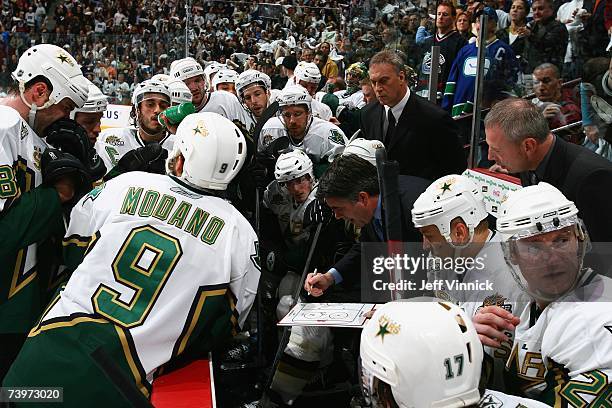 Head coach Dave Tippett of the Dallas Stars diagrams a play from the bench against the Vancouver Canucks during Game 7 of the 2007 Western Conference...