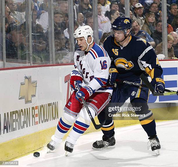 Sean Avery of the New York Rangers and Dmitri Kalinin of the Buffalo Sabres fight for position on the puck during Game 1 of the 2007 Eastern...