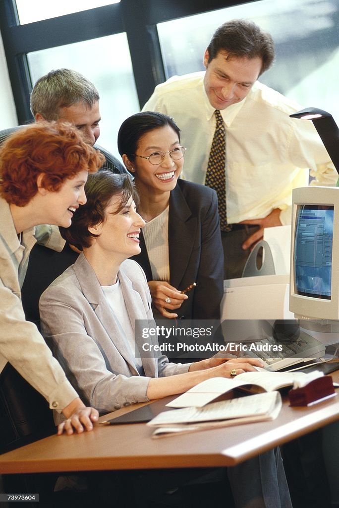 Group of businesspeople working together at desk