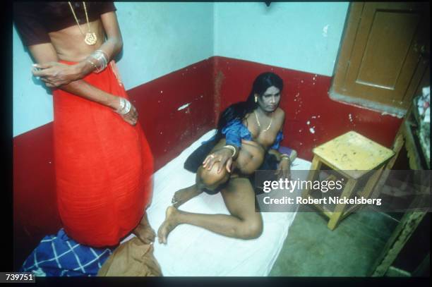 Eunuchs sit in a hotel room April 24, 1994 in Villupuram, India. Eunuchs, called "hijras" are mostly men castrated at puberty, were once invited to...